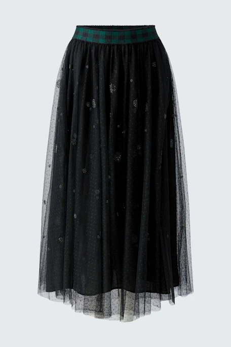 Black A-line skirt with sheer overlay and plaid waistband, displayed on a hanger.