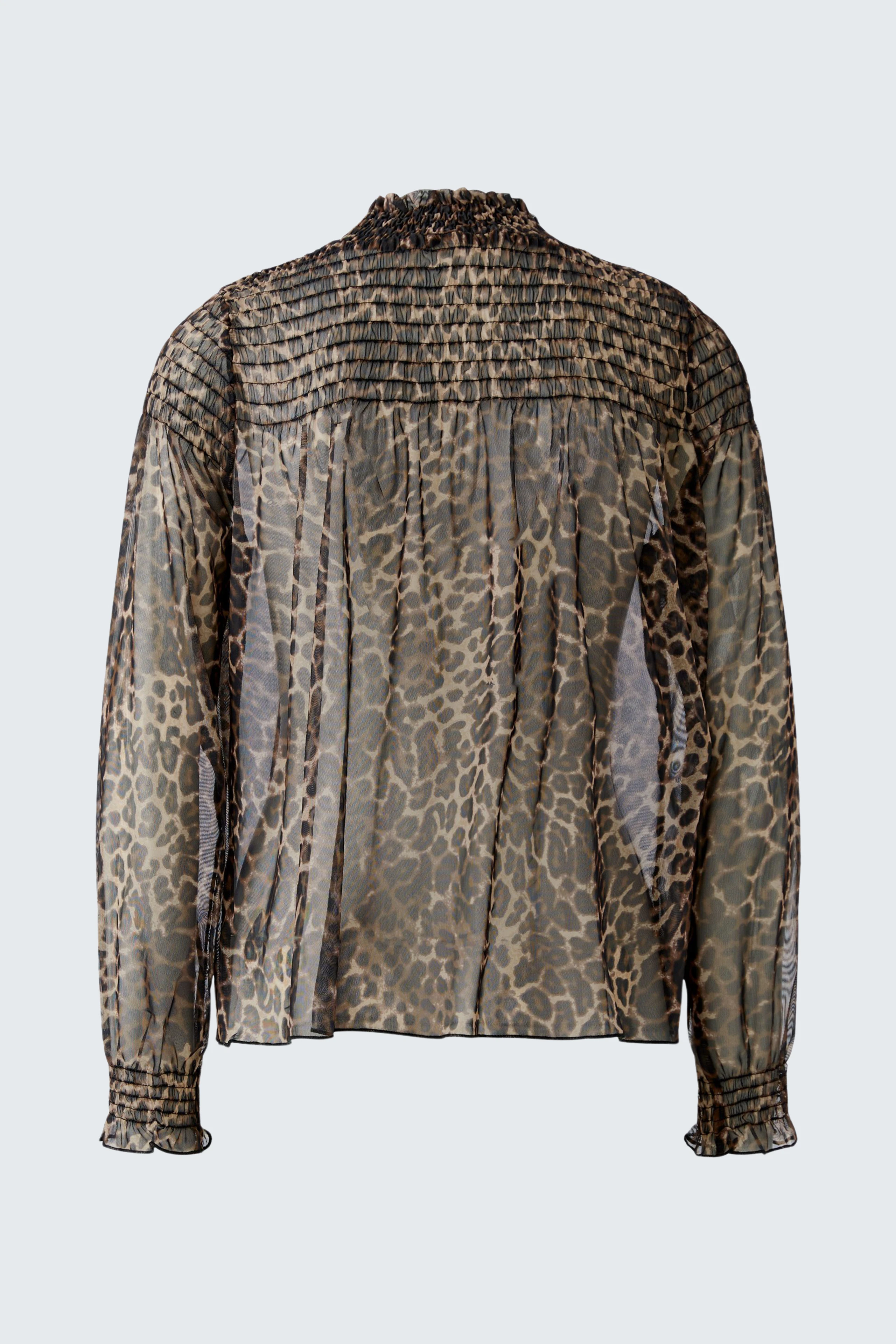 Sheer long-sleeve shirt with animal print, showcasing a stylish and bold design for modern women.